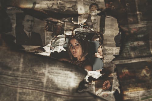 Woman through a Burnt Newspaper Hole