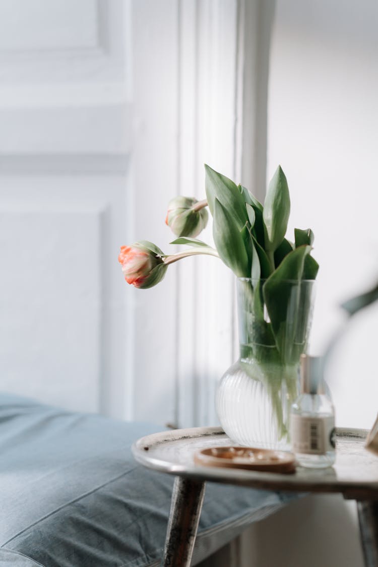 Tulips In A Vase On A Small Table