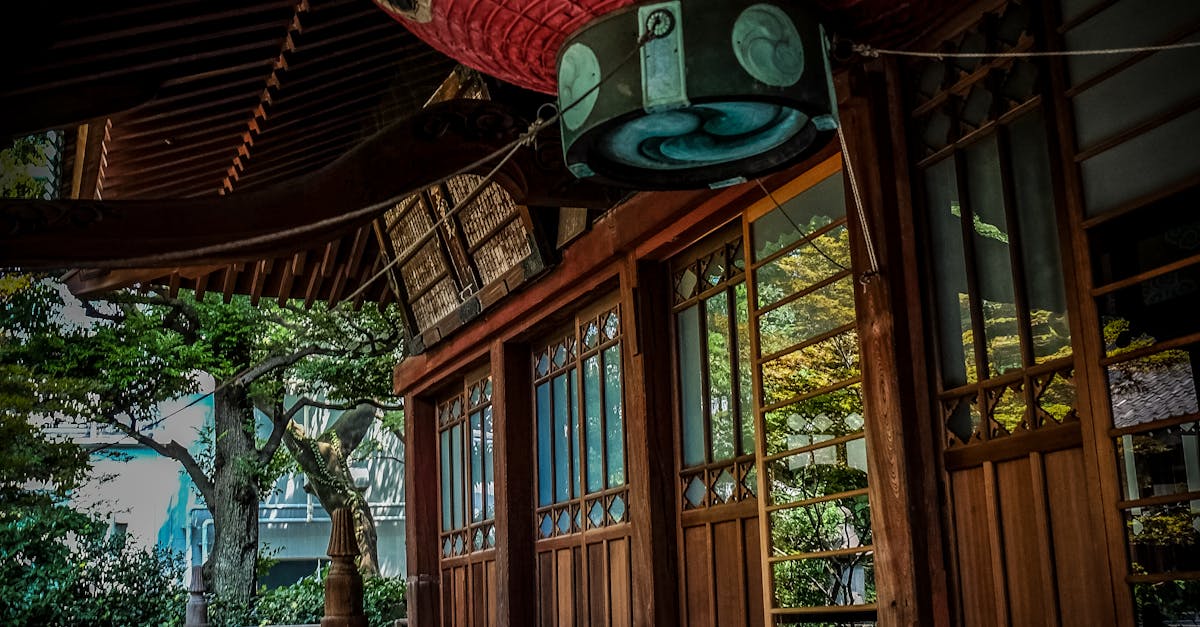 Red Green and Black Floating Lantern With Kanji Text Decoration Above Stairs