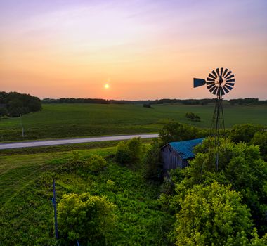Blue House Near Green Trees during Sunset