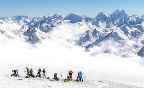 Skiers in a Summit Mountain 