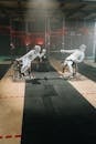 Two men in wheelchairs fencing