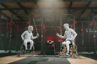 Two men practicing fencing