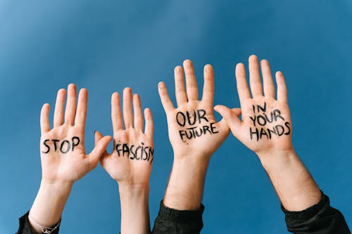 Hands with Message Stop Fascism Our Future in Your Hands