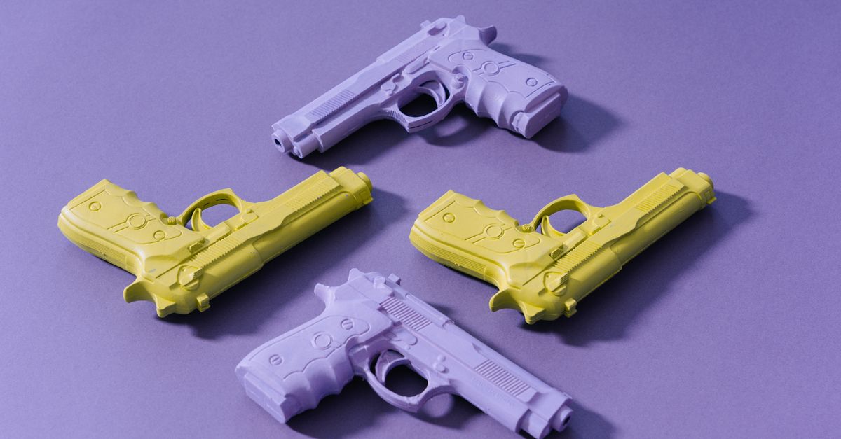 Yellow And Purple Toy Guns · Free Stock Photo