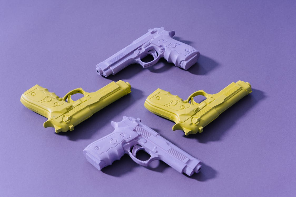 Yellow And Purple Toy Guns