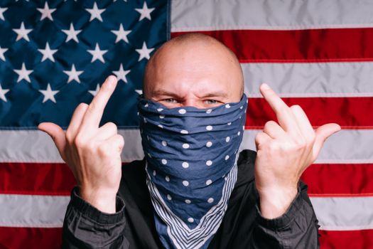 A Man Covering Face with Handkerchief Giving an Obscene Hand Gestures