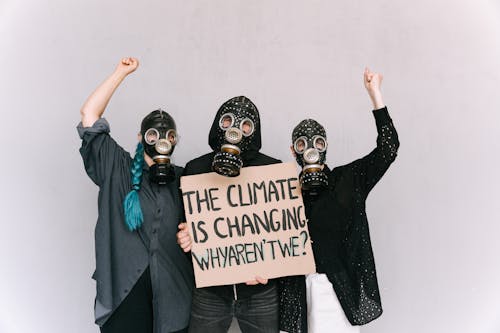 People holding a Placard