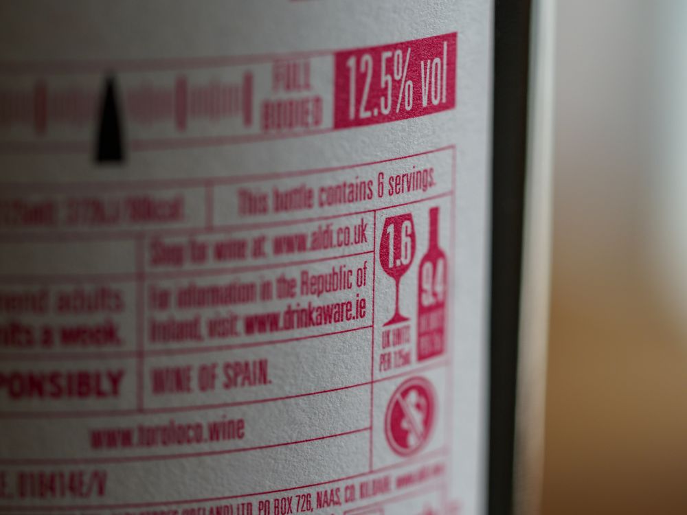 Red and White Label Of Bottle · Free Stock Photo