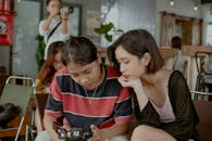 People Looking At Dslr Camera