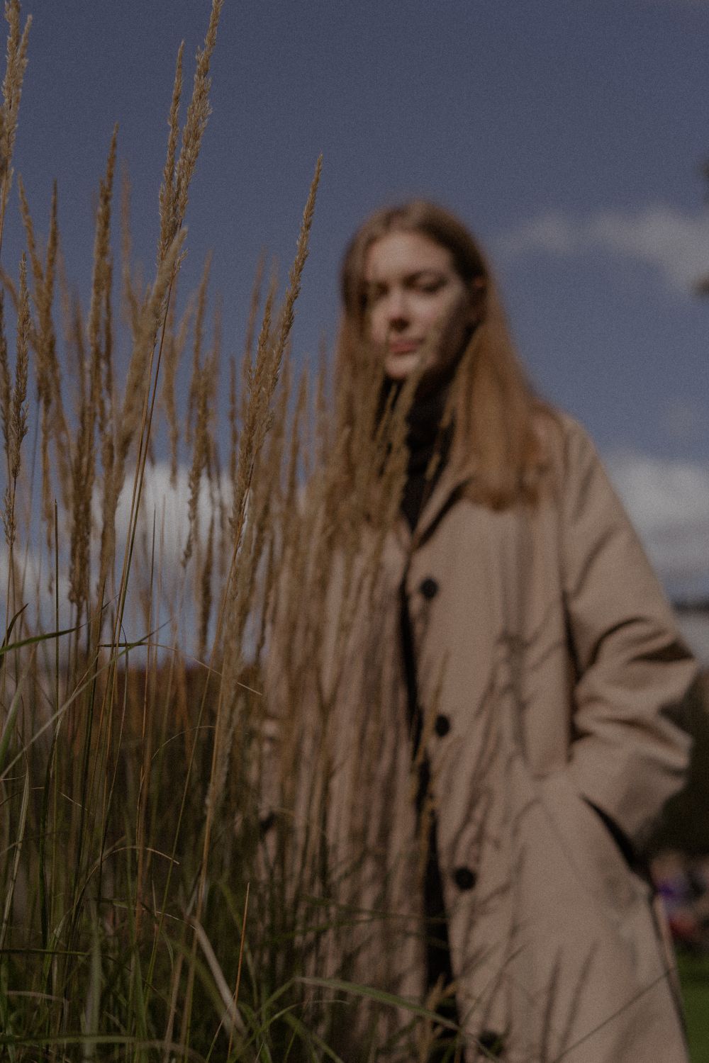 Photograph of a Woman in a Brown Coat Standing Near Dry Grass · Free ...