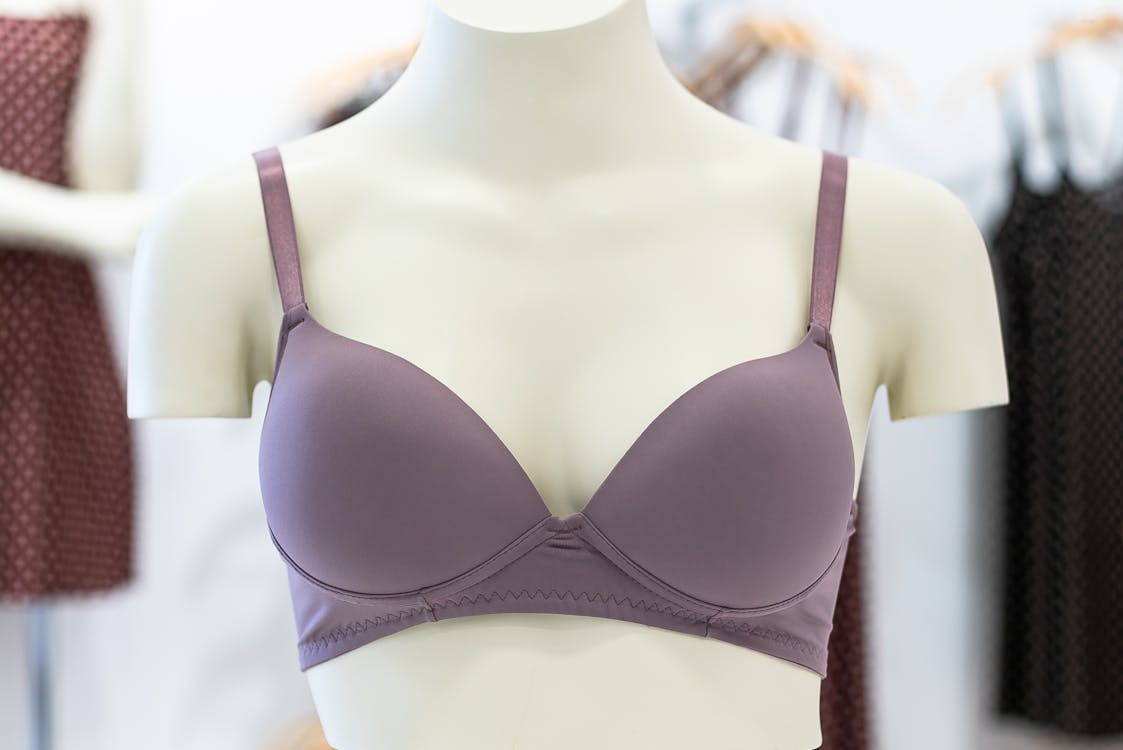 Photo of a Lavender Bra on a White Mannequin · Free Stock Photo