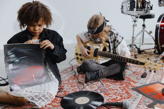 Two children immersed in music with vinyl records and electric guitar, capturing youthful creativity.