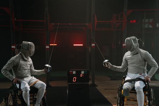 Paralympic foilers in fencing masks
