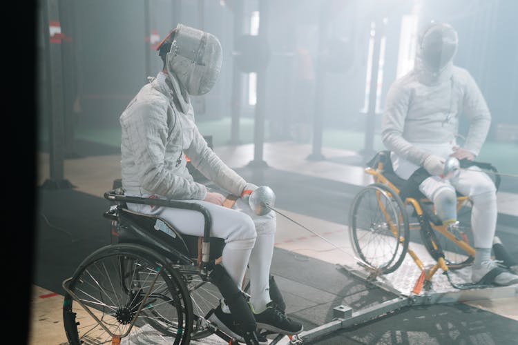 Paralympic Foilers in Fencing Masks