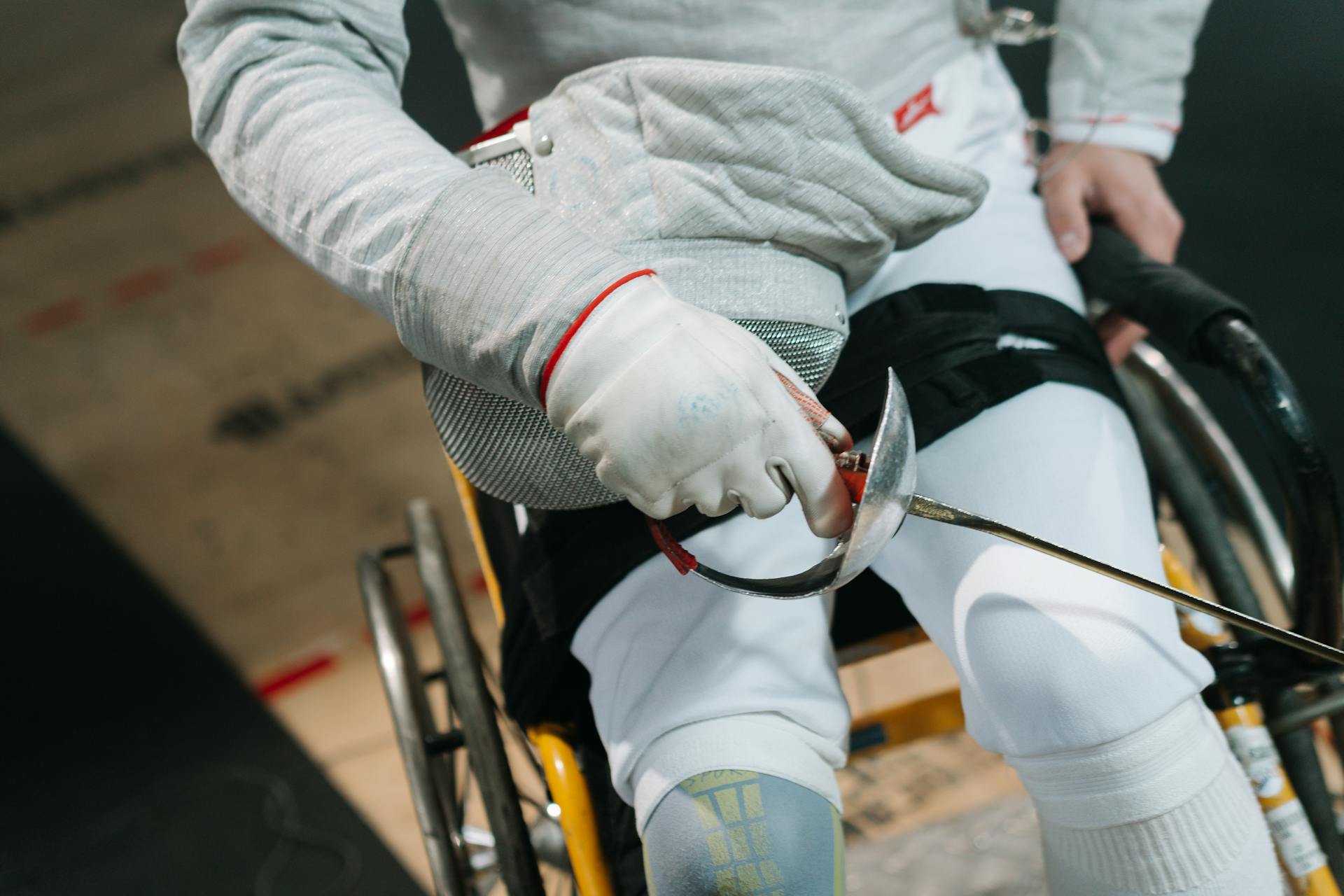 Close up view of human hand holding sabre