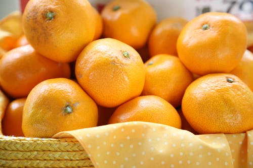 Free Oranges on a Woven Basket Stock Photo