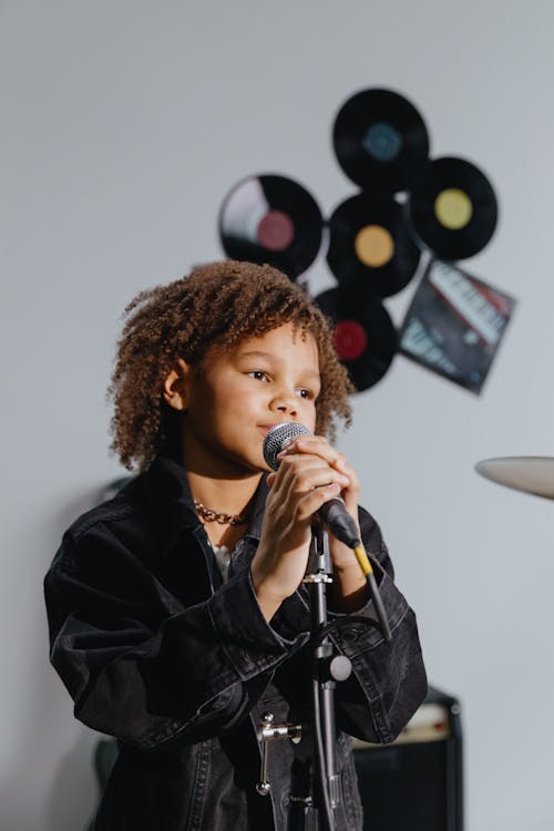 Free An Afro-Haired Kid Singing  Stock Photo