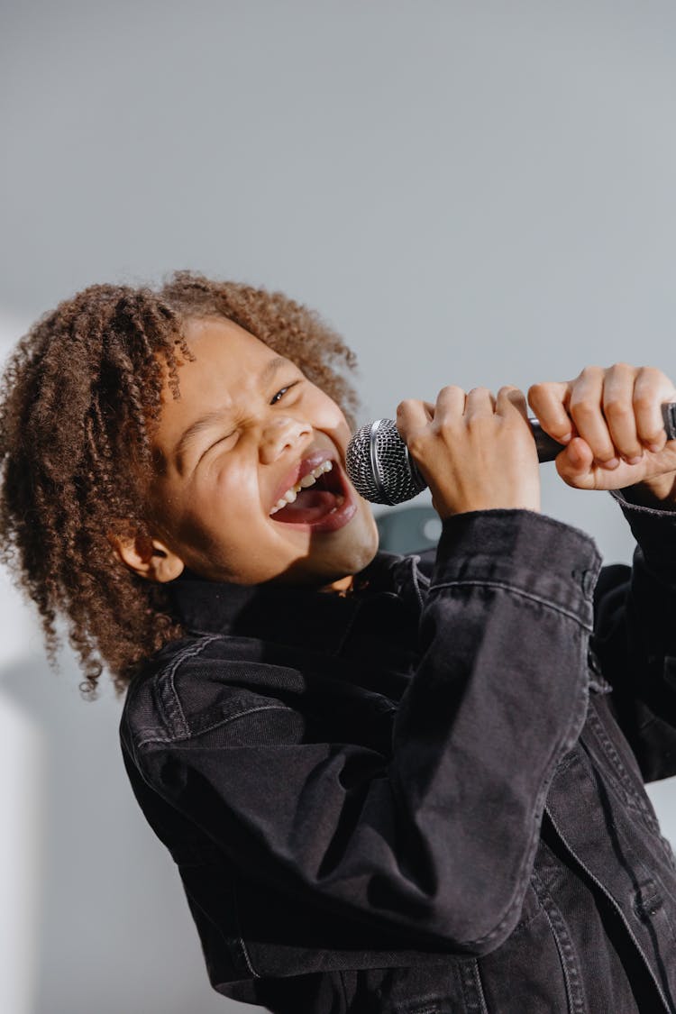 An Afro-Haired Kid Singing