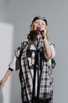 Close-Up Shot of a Girl Holding a Microphone