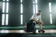 A Man Sitting on a Jump Box