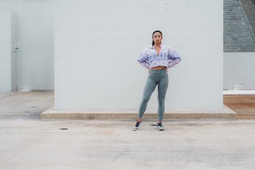 Young Woman in Sportswear Doing Fitness on the Roof