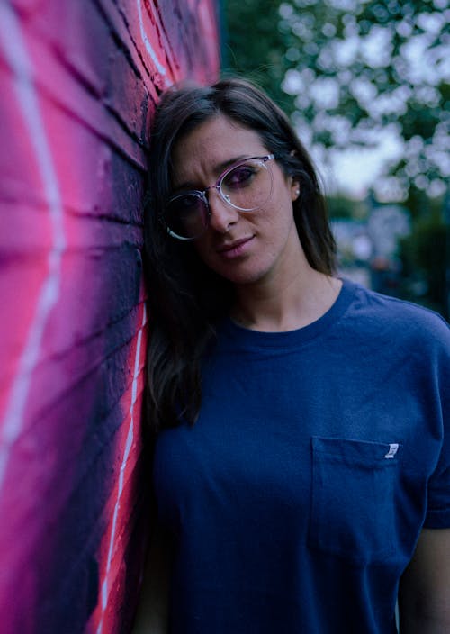 Woman in Blue Crew Neck Shirt Wearing Eyeglasses