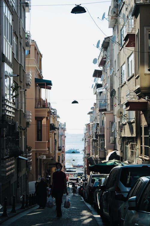 Photo of a Street with Cars and People