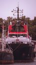 White and Red Ship on Body of Water