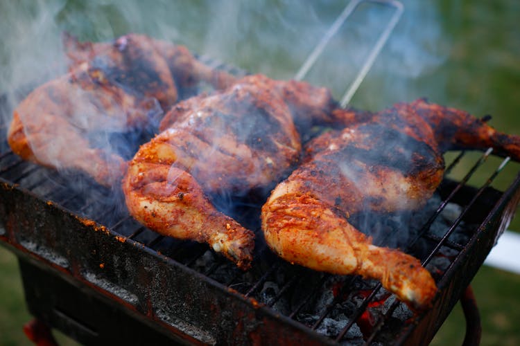 Grilled Chicken On Black Charcoal Grill