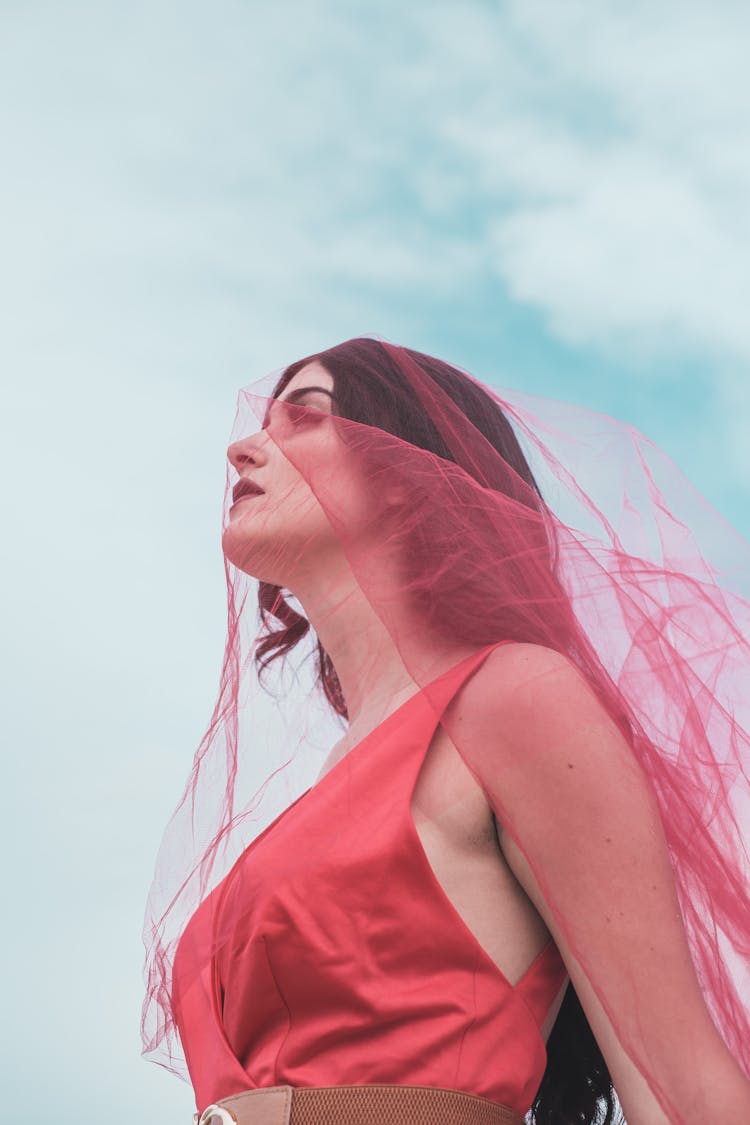 Woman Standing In Red Dress And Veil