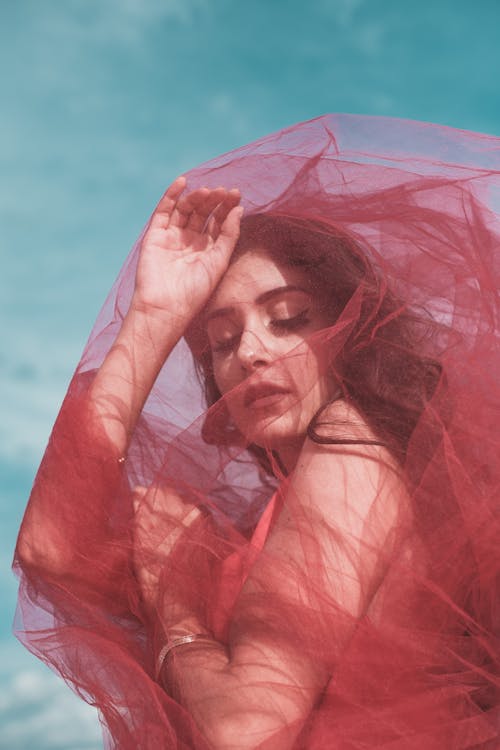 Free Woman Covered with Red Tulle Stock Photo
