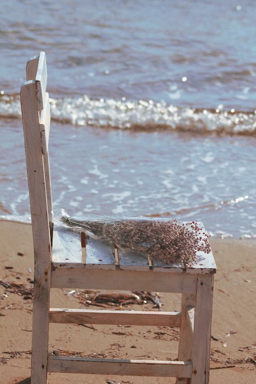 White Wooden Chair on the Beach