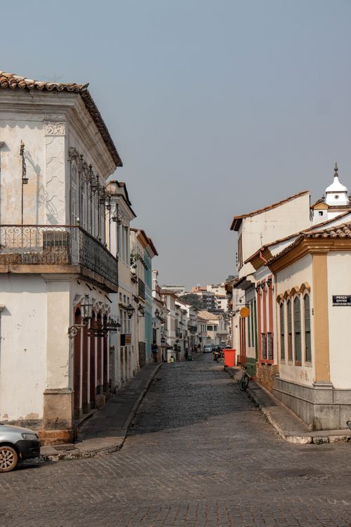 Free Charming view of rustic buildings lining a narrow street in São João del Rei, capturing Brazilian colonial architecture. Stock Photo