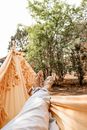 Woman lying on hammock 