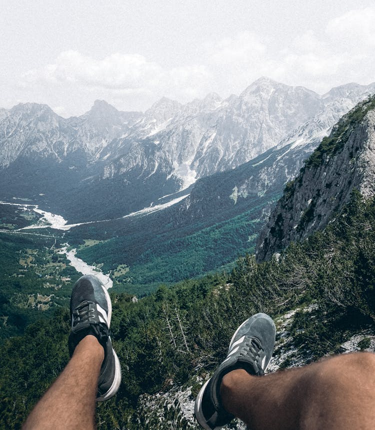 Man Legs On Mountain Peak