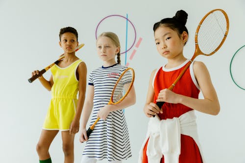 Girls Holding Tennis Rackets