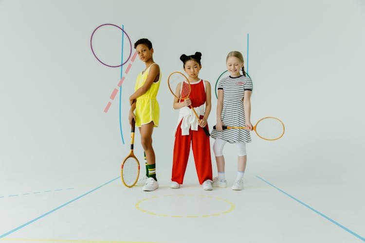 Kids Holding Badminton Racket