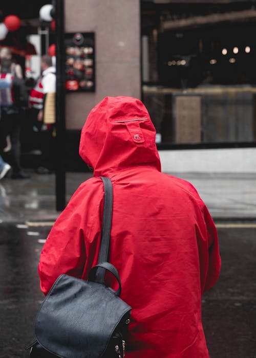 Free Back View of a Person Wearing a Red Jacket Stock Photo