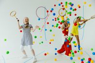 Girls in Sportswear Having Fun Playing with Colorful Balls