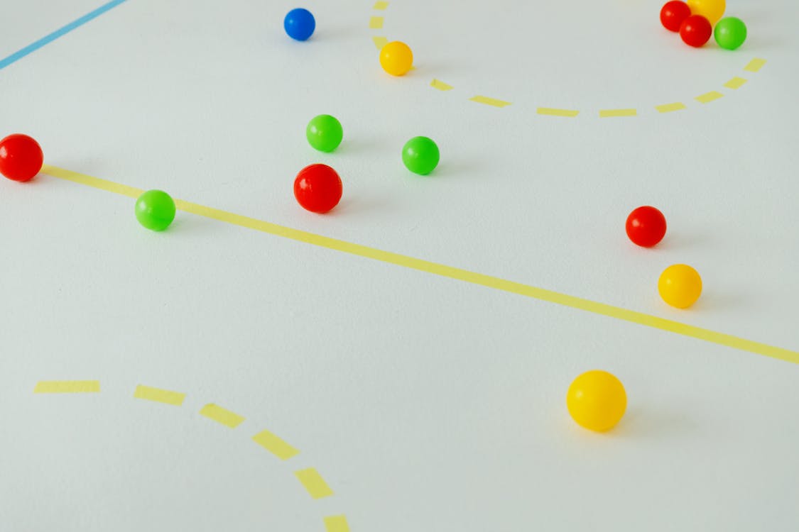 Free Colorful Balls Scattered on the White Floor Stock Photo