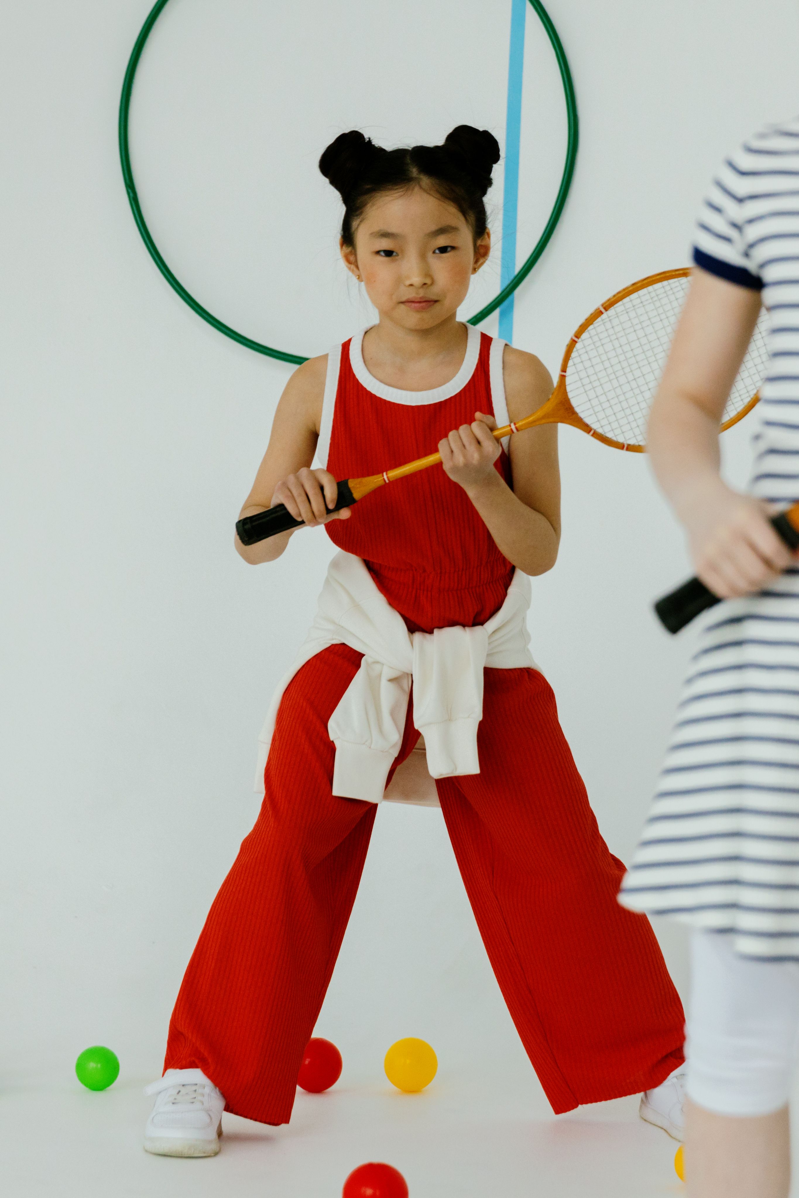 Girl Holding a Racquet · Free Stock Photo