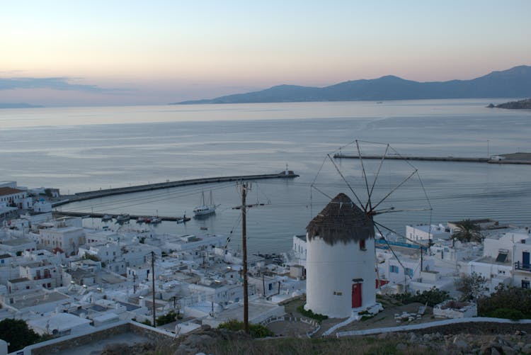 Windmill In Town On Sea Shore