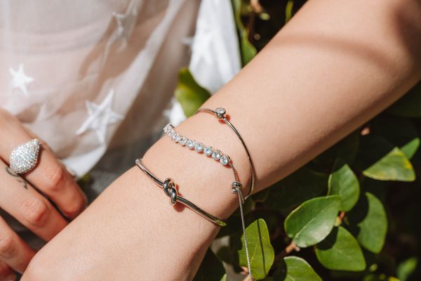 Stacked beaded bracelets worn on a wrist