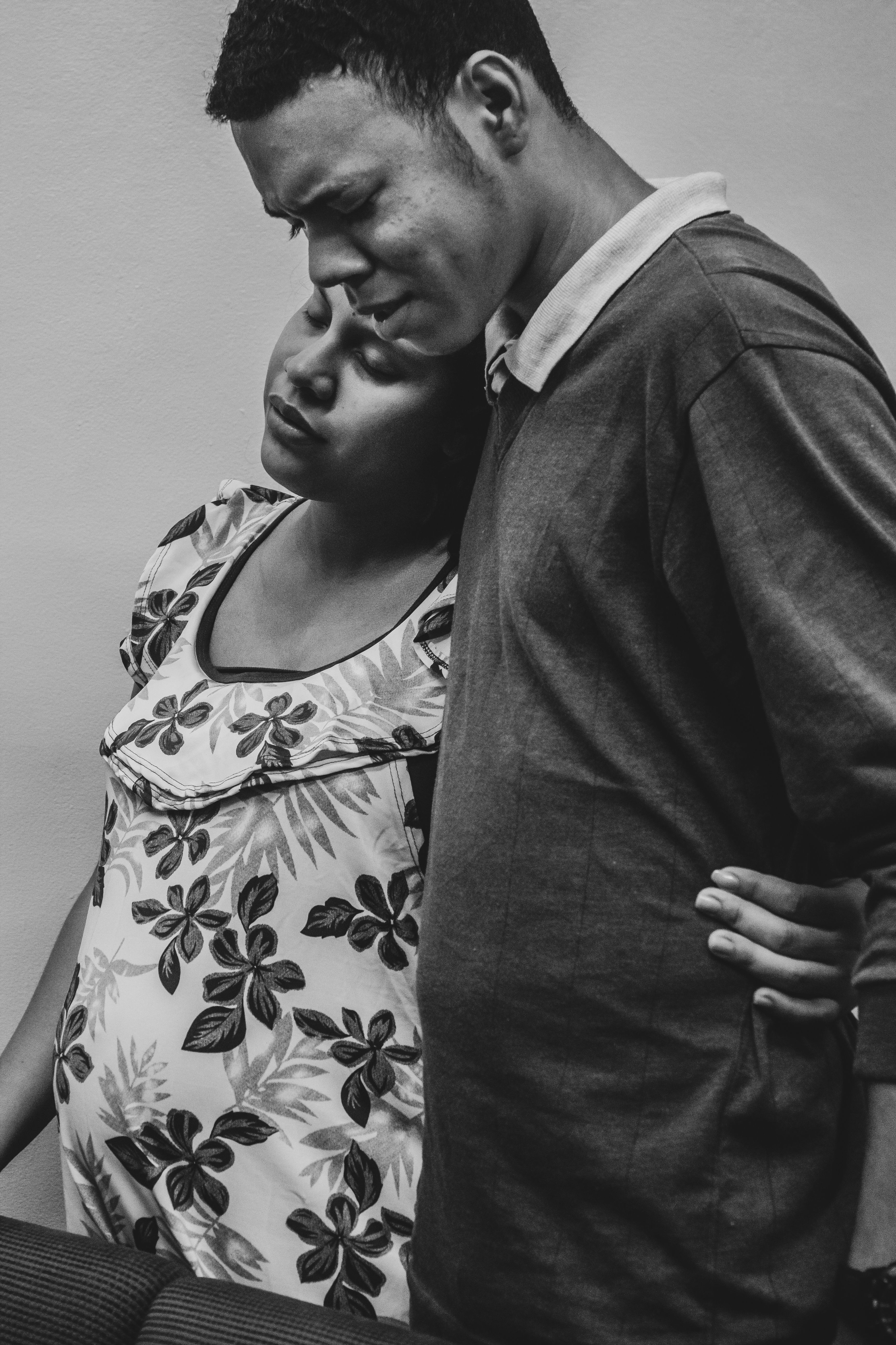 A couple praying together at home