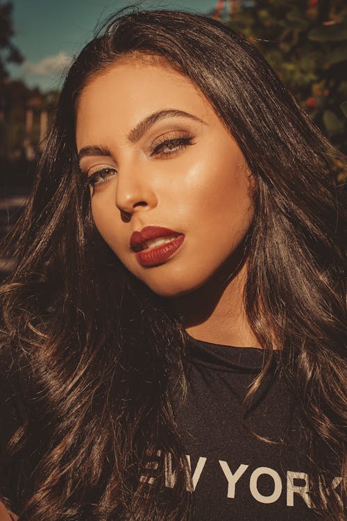 A Woman Posing with Red Lips