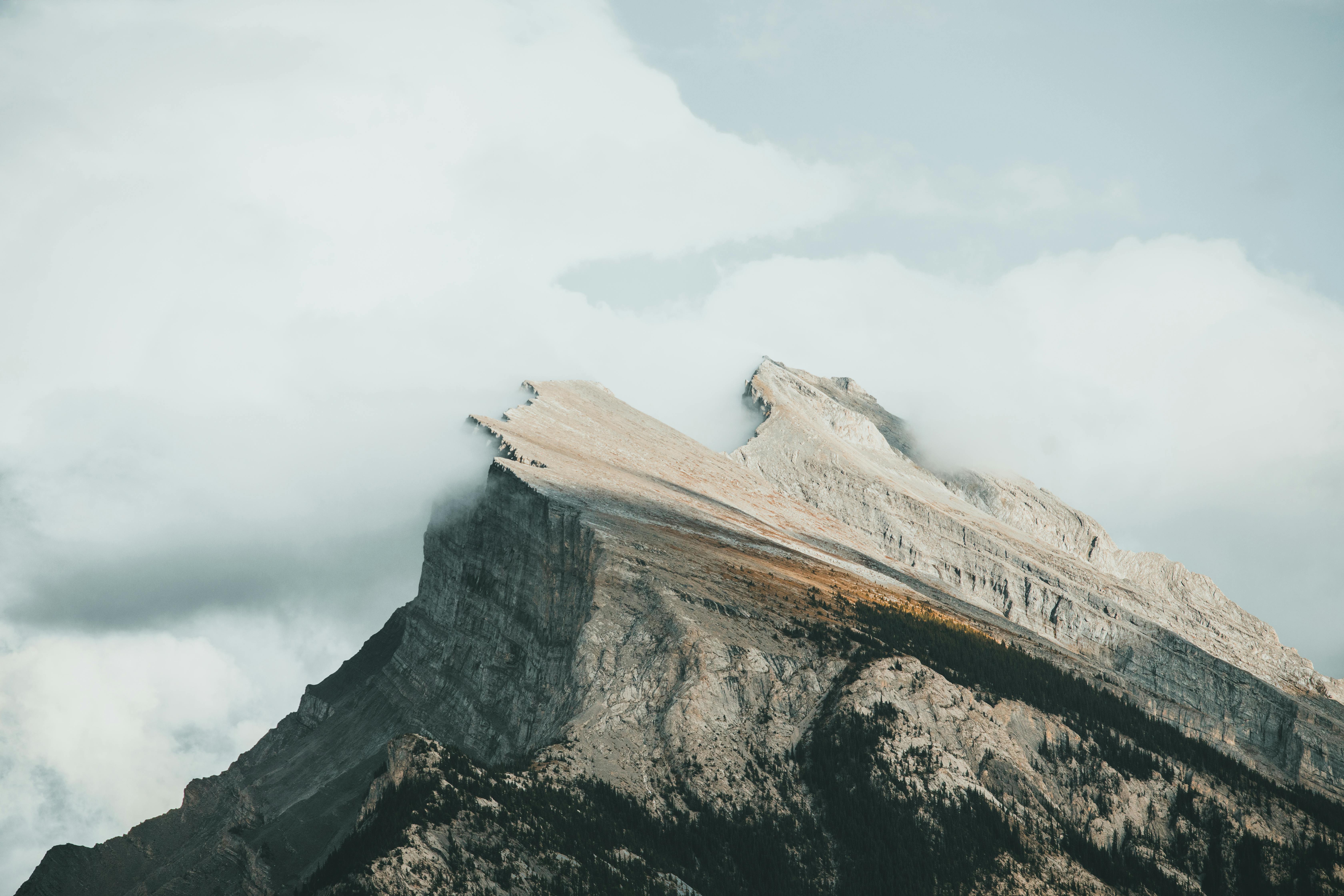 a mountain top in clouds