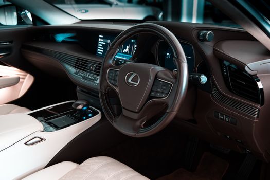 Explore the luxury and modern design of a Lexus car interior showcasing leather seats and high-end controls.