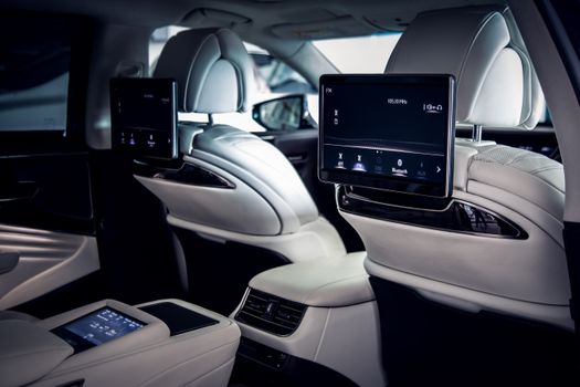 Explore the luxurious and modern interior of a high-end car, showcasing advanced technology and comfort.