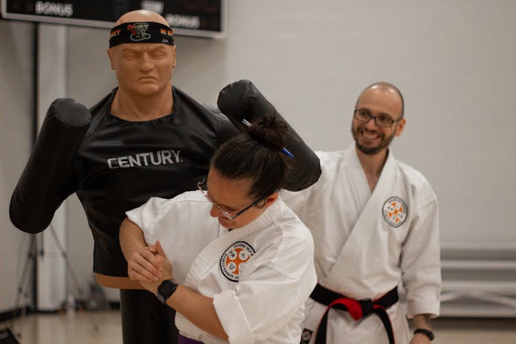 Woman Hitting The Karate Mannequin